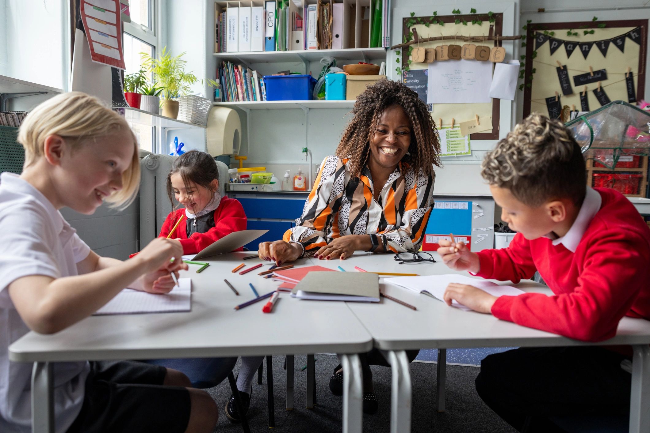 Teacher and children learning together in a welcoming classroom