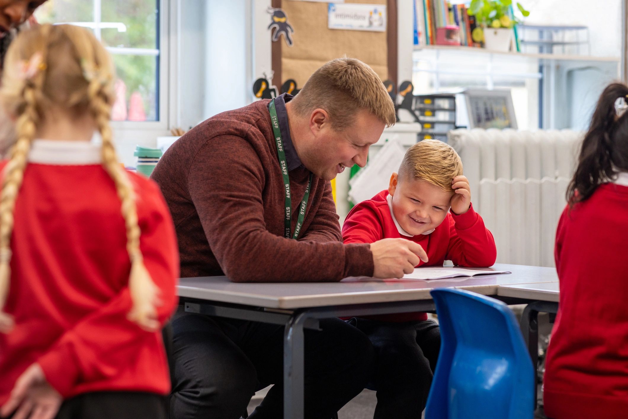Educator helping a child with learning activities